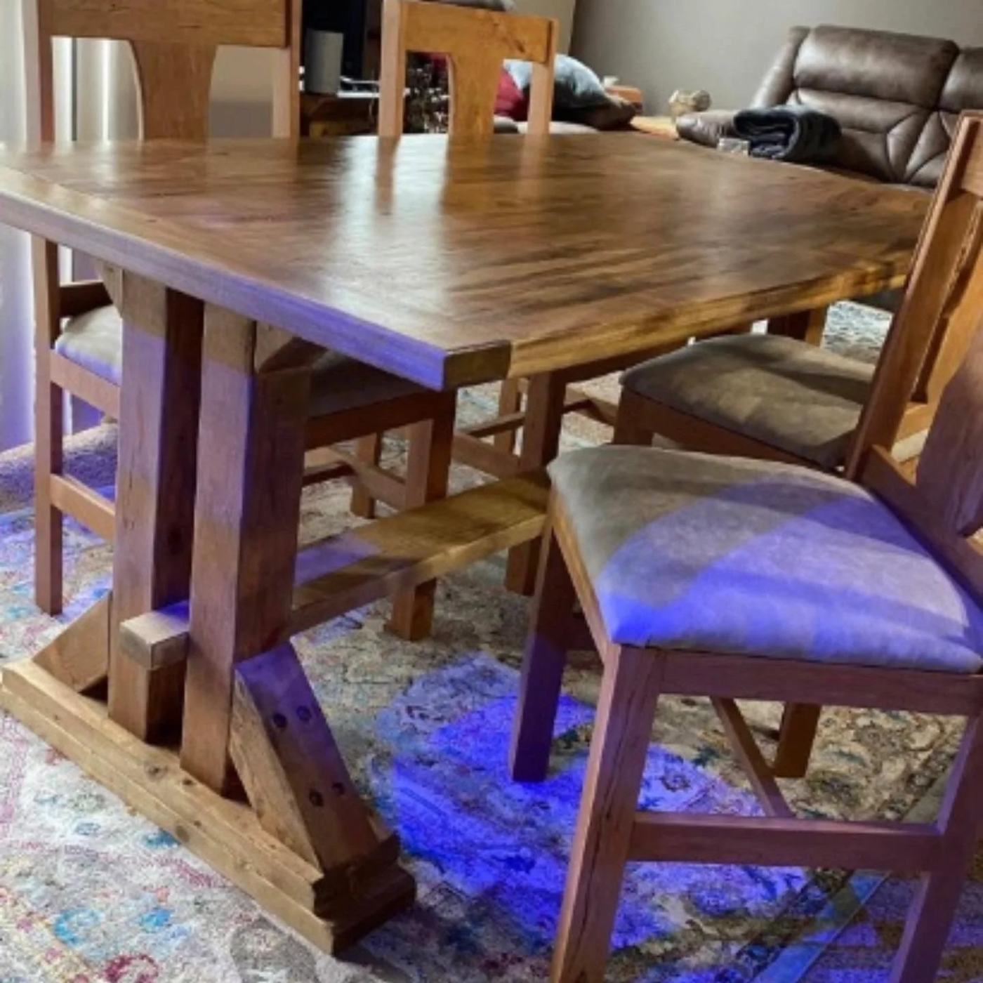 Trestle dining table with matching chairs in a family dining room