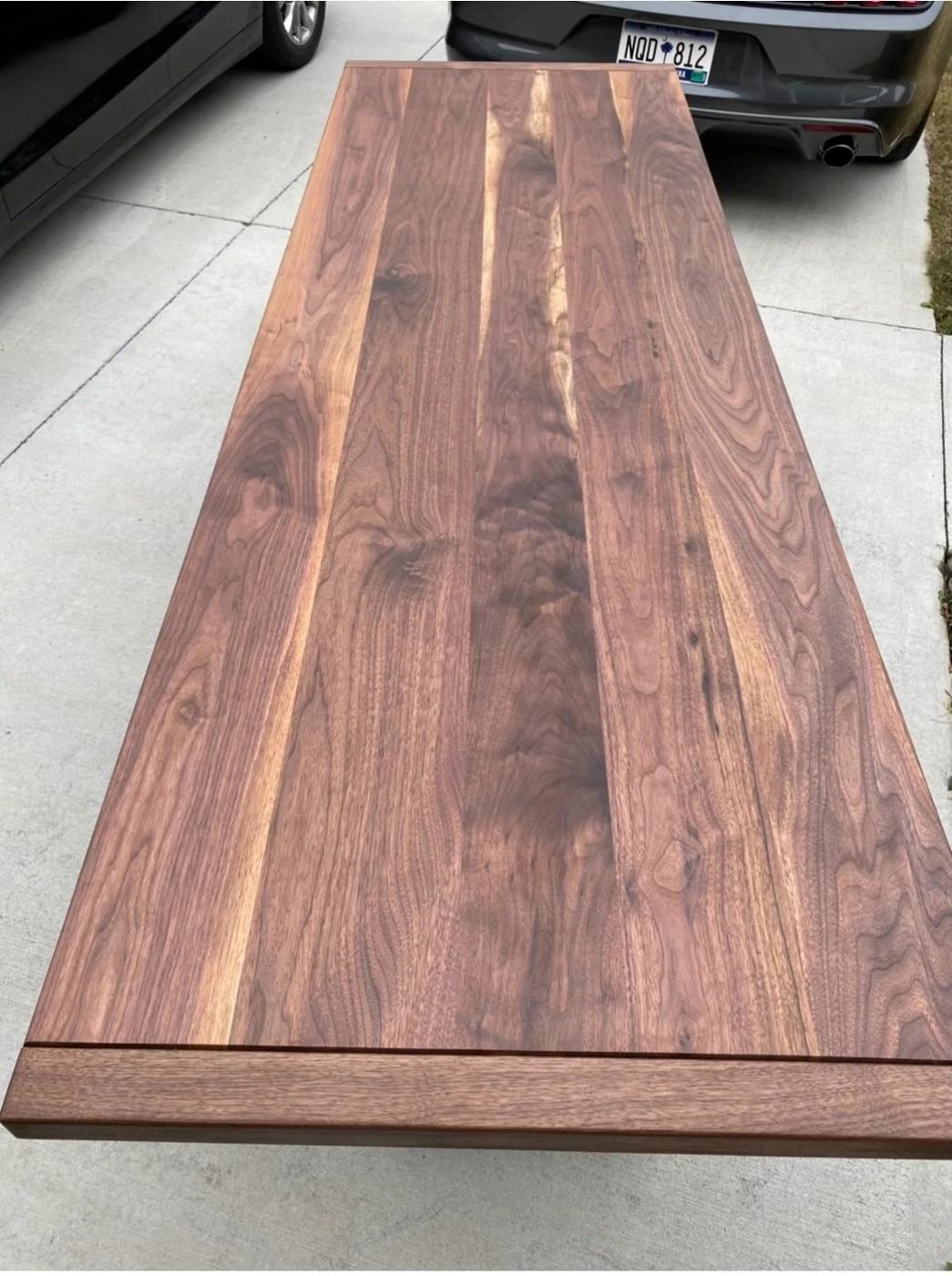 Finished black walnut tabletop with a rich satin sheen